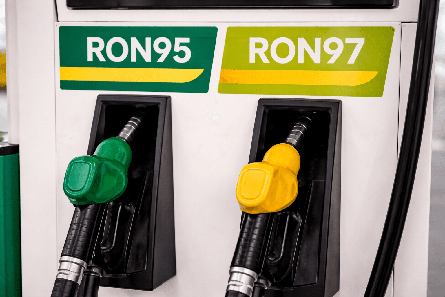Busy Malaysia petrol station with multiple pump islands and customer cars