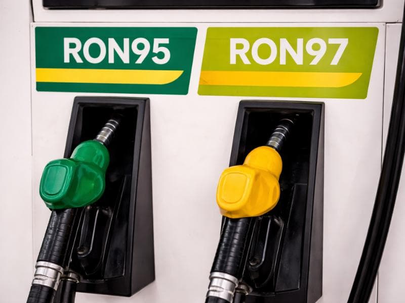 Busy Malaysia petrol station with multiple pump islands and customer cars