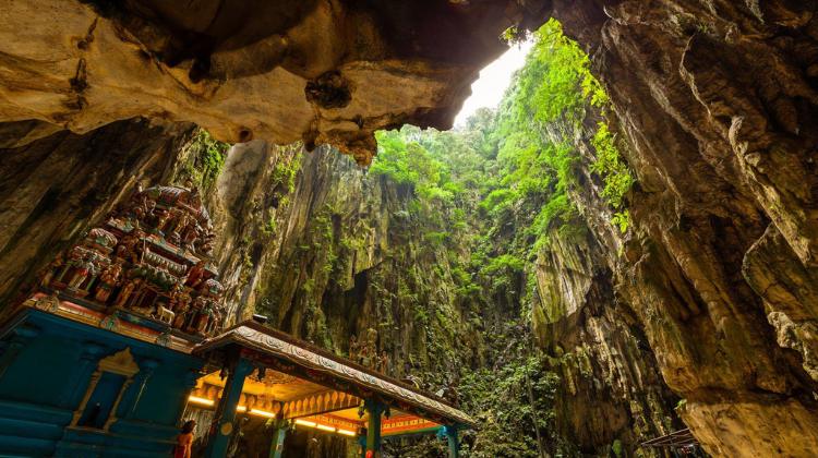 Batu Caves with Hindu temple and tourists